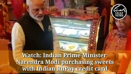 Indian PM Narendra Modi makes his first purchase using the RuPay in the UAE