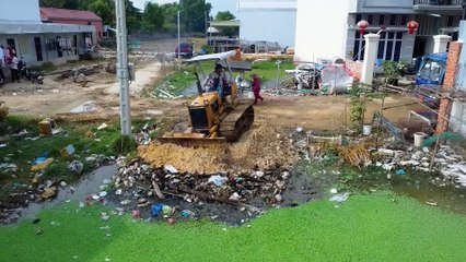 completed project with bulldozer D21 & 5T Truck posting Stone into Flooded land