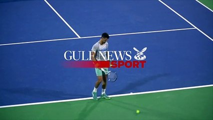 Novak Djokovic practices on Center Court at the Dubai Tennis Stadium