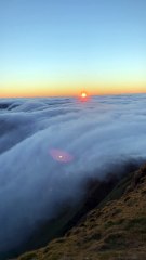 Rare cloud inversion looks like a dreamy waterfall of soft cotton