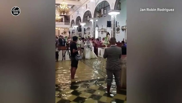 Filipino bride walks down flooded aisle after Typhoon Doksuri hits Philippines