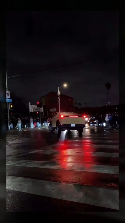 A cybertruck attempts to do donuts during a street takeover