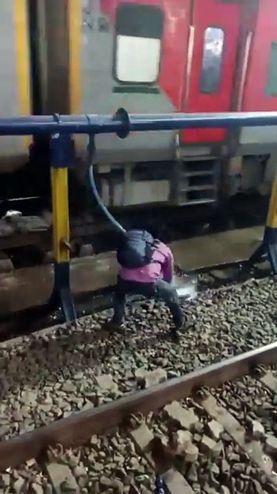 Goon Spraying Water on Passengers