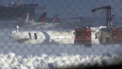 Video: Delta plane lies upside-down after Toronto airport crash