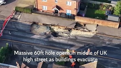 Massive 60ft sinkhole opens in middle of UK high street as buildings forced to evacuate