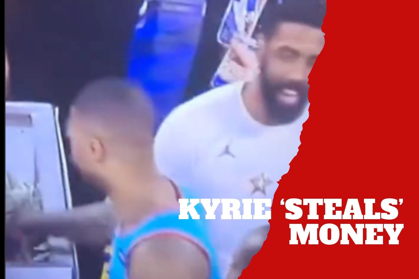 Kyrie Irving "borrows" some prize money during the cash out of a contest winner at an NBA game