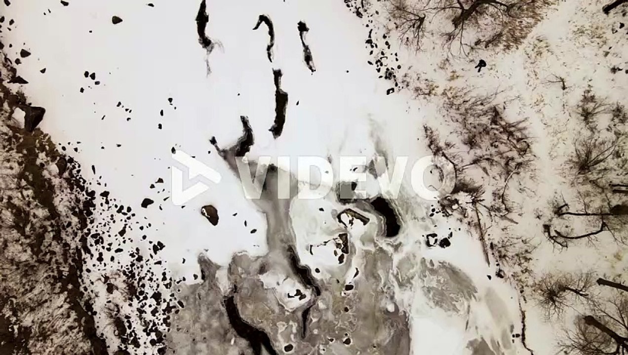 Arial view of frozen river during the winter