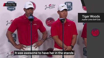 Woods makes emotional return after mother's death