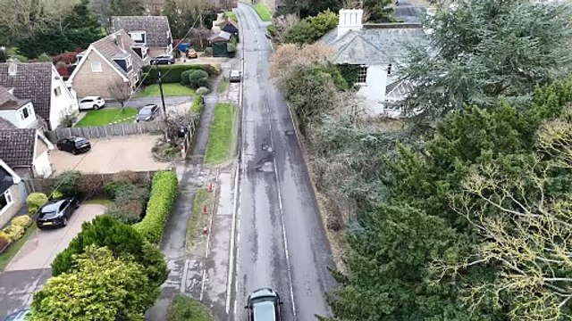 Drone footage shows drivers swerving into oncoming traffic to avoid huge potholes
