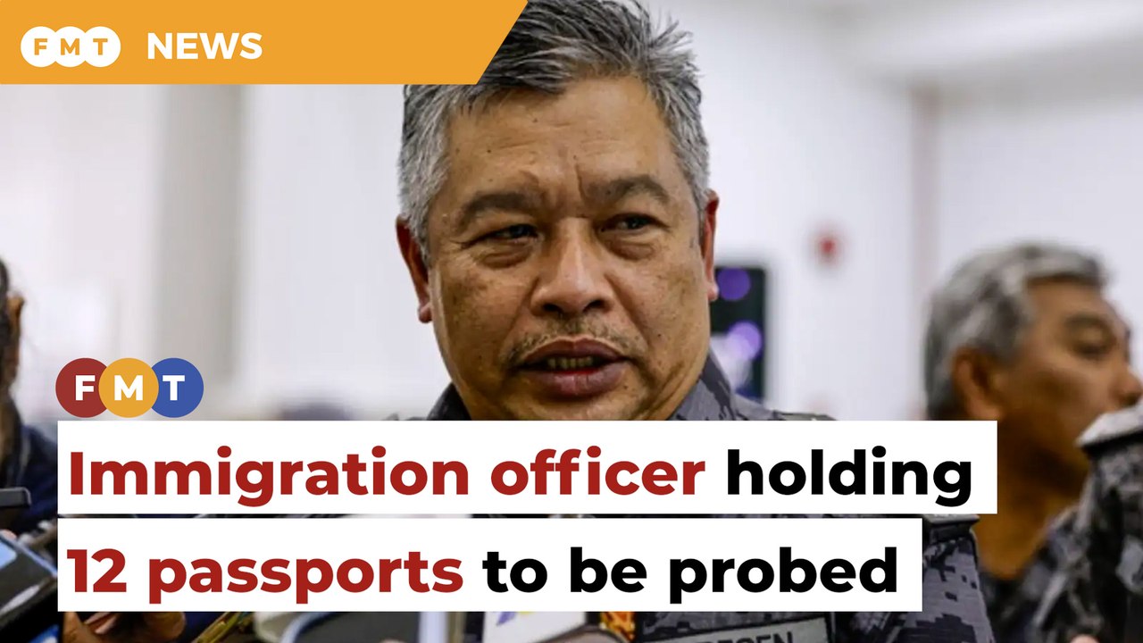 Probe launched after immigration officer found holding 12 foreign passports