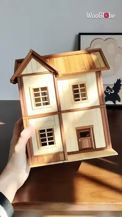 Stunning miniature wooden house crafted with precision showcases incredible craftsmanship