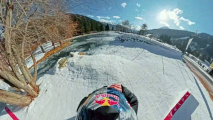 Red Bull's Pierre Vaultier cutting through floating shapes on Pontillas Lake