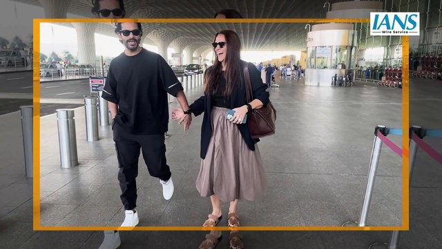 Neha Dhupia & Angad Bedi Spotted At Mumbai Airport twinning in black outfit