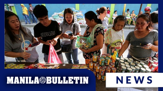 Residents in Mandaluyong exchange their recyclable waste for kilos of rice, canned goods