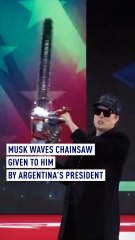 Musk waves chainsaw given to him by Argentina’s President Milei