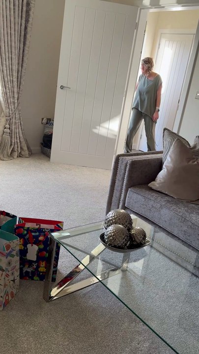 Little boy meets baby sister but is more interested in his new toys