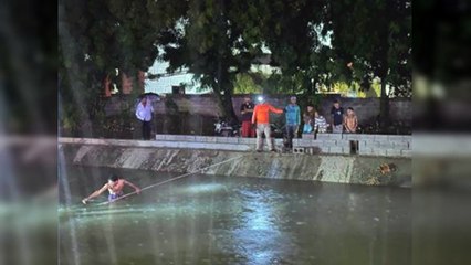 Hombre es rescatado de un canal de riego en Santiago Oeste