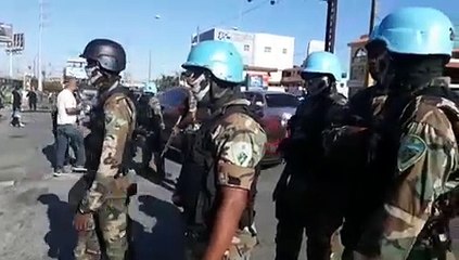Policías y militares en el 12 de Haina durante el paro de transporte