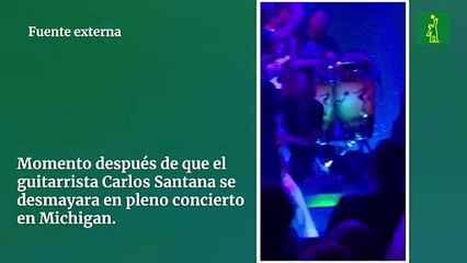 Momento después de que el  guitarrista Carlos Santana se desmayara en pleno concierto en Michigan.