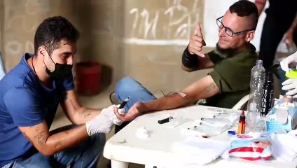 En Colombia dibujan con sangre mural de Residente