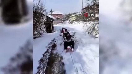 ATV’ye bağlı kızaklarla kayak keyfi yaptılar