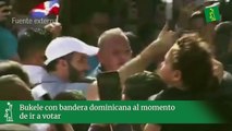 Bukele con bandera dominicana al momento de ir a votar