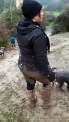 Woman Slips and Falls Down Muddy Hill