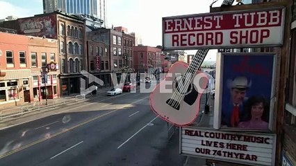 slow aerial push into record shop sign on broadway street in nashville tennessee
