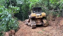 Bulldozer D6R XL Working on the Most Difficult Mountain Trail