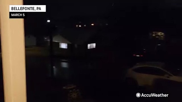 Rain and gusty winds sweep across the East Coast