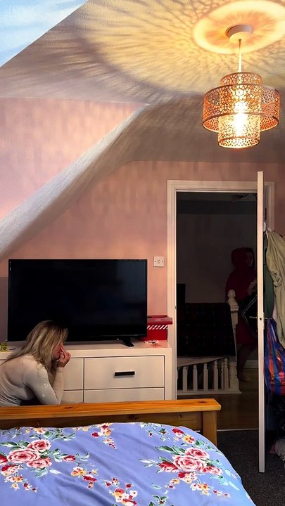 Woman Hides in Her Friend's Room and Suddenly Shouts to Scare Her