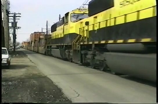 NS Train 290 with NYS&W units street running 19th and Poplar. Erie, PA. 3-29-96. Time 9_52 am.