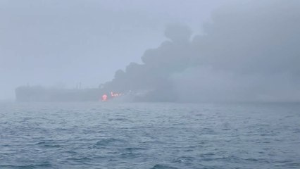 Fire and smoke rising from tanker collision scene off UK coast