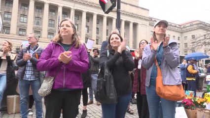 Terminated USAID employees applauded as they vacate offices in wake of Trump's cuts to foreign aid
