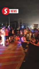 Over 1,000 foreign workers halt traffic in Teluk Intan in protest of fatal accident