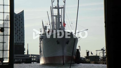 Cap San Diego parking in front of Hamburg Elbphilharmonie on river Elbe early in the morning