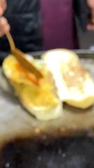 Adding Chili Sauce to burger