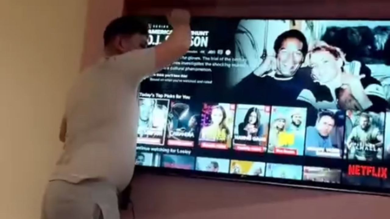 TV slipped off the wall mount but man's reflexes saved it in time
