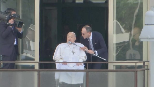 Pope Francis makes first appearance since hospital admission in front of cheering crowds
