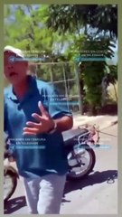 HOMBRE ARRASTRA A PERRO