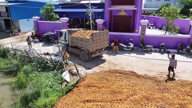 A new project is underway to clear the former flooded rice fields using a mini bulldozer.
