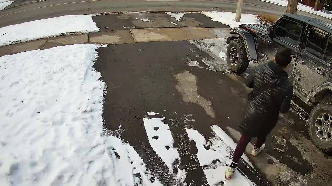 Woman Slips and Falls While Getting Into Her Car in Driveway