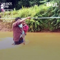 Crossing Floodwaters To Get To School