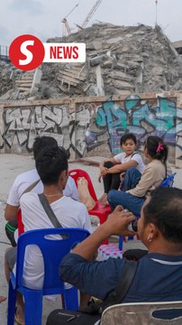 Families, friends of missing workers at collapsed Bangkok construction site cling to hope