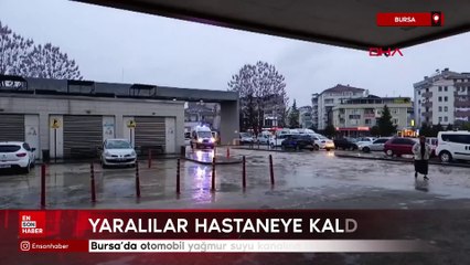 Bursa'da otomobil yağmur suyu kanalına düştü