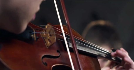 Close Up Pan Down Of Violinist Playing Violin