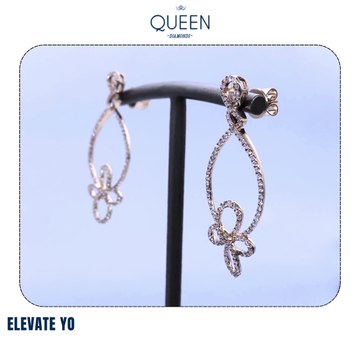 Elevate your elegance with our exquisite Teardrop & Floral Diamond Earrings from Queen Diamonds Dubai.