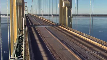 Falling chunks of ice narrowly miss vehicles on the Mackinac Bridge