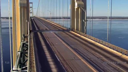 Falling chunks of ice narrowly miss vehicles on the Mackinac Bridge