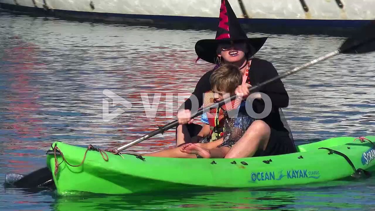 Witches In Costume Paddle On Surfboards And Paddleboards To Celebrate Halloween In Ventura Harbor, California